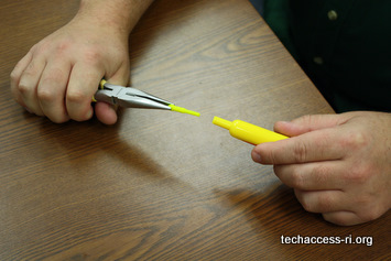 Photo of marker tip being removed with pliers