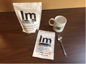 This is a photo of a bag of Instamorph, Instamorph color packet, spoon, and TechACCESS mug
