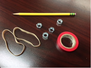 This is a picture of the materials needed: a pencil, hex nuts, tape, and rubber bands