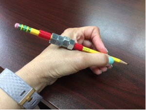 This is a picture of a person holding the completed weighted pencil