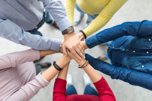 this is a picture of hands placed on top of each other