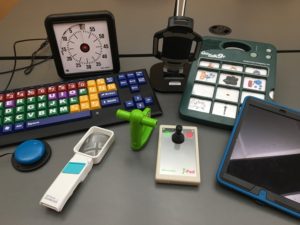 This is a photo of a variety of assistive technology tools