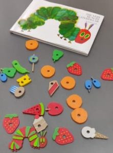 The book The Very Hungry Caterpillar with 3d printed images from book